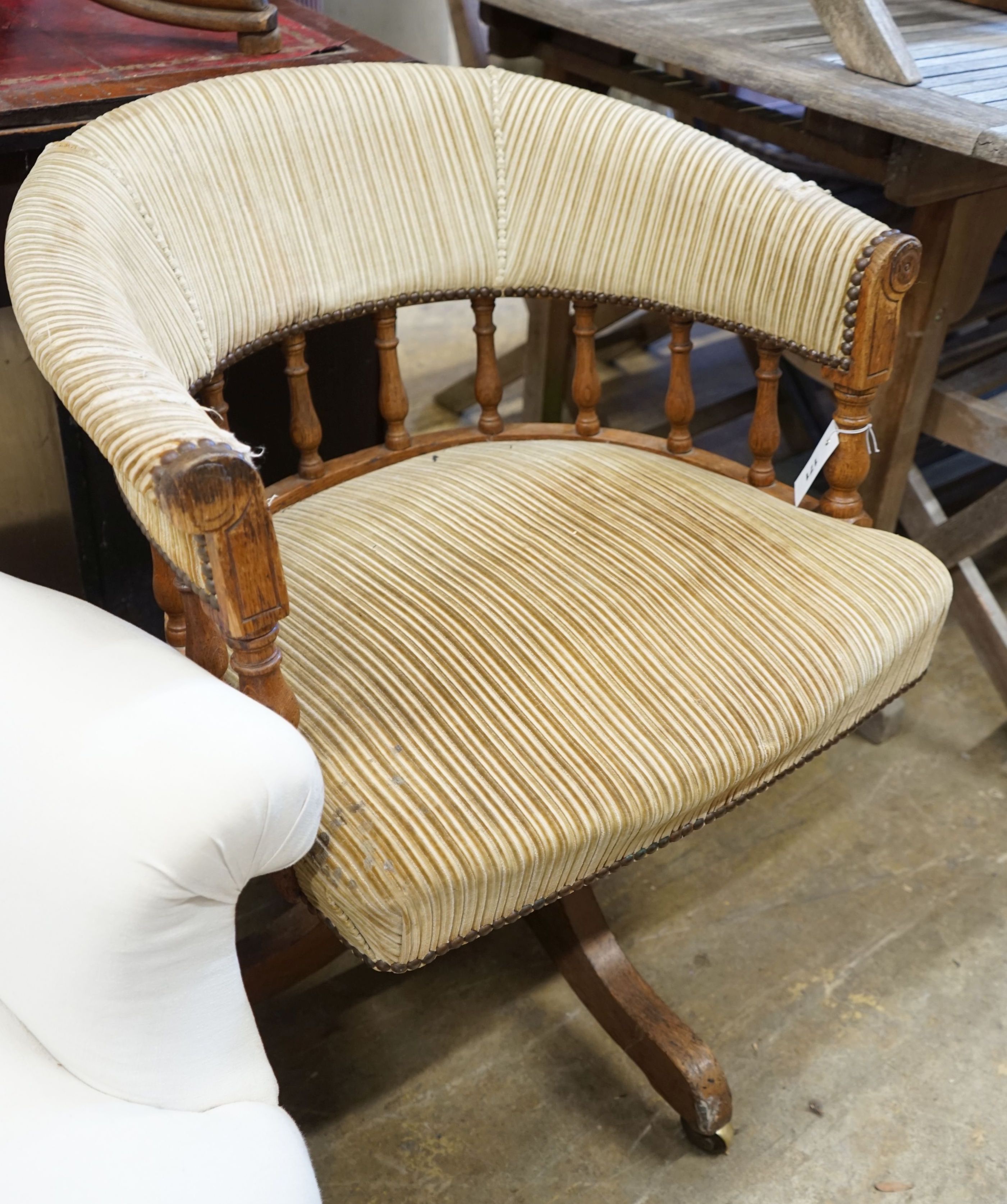 An early 20th century oak captain's chair